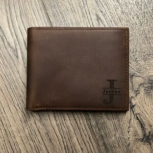 Brand new unused full grain leather wallet. Engraved name Joshua and a psalms.